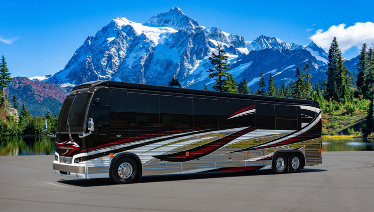 Luxury Motor Coach in front of mountains