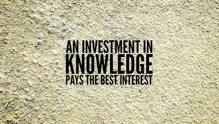 A sign that says, "An investment in knowledge pays the best interest." It illustrates the concept of the power of curiosity.