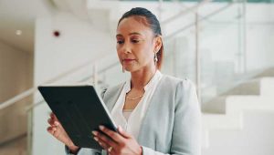 Woman planning her will on a tablet standing up