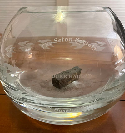 Engraved Seton Society glass bowl with personalized design and coal inside, symbolizing a donor’s roots and story.